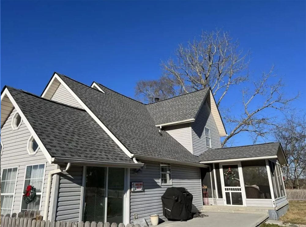 house with repaired roof in knoxville, grey roof and siding