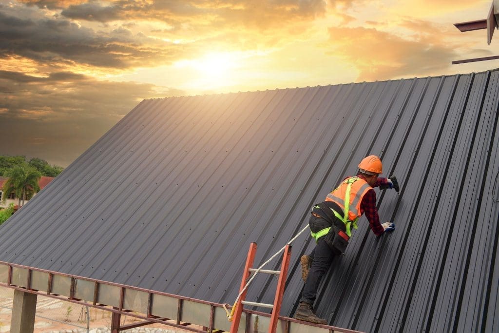 construction worker on metal roof